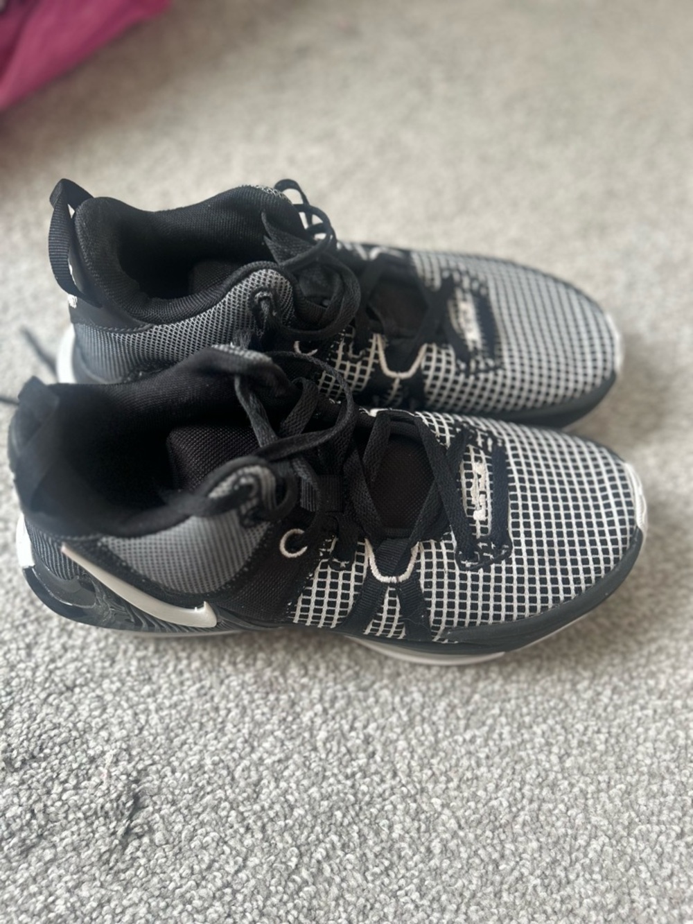 Nike woman’s Black and White Grid-Pattern Sneakers
